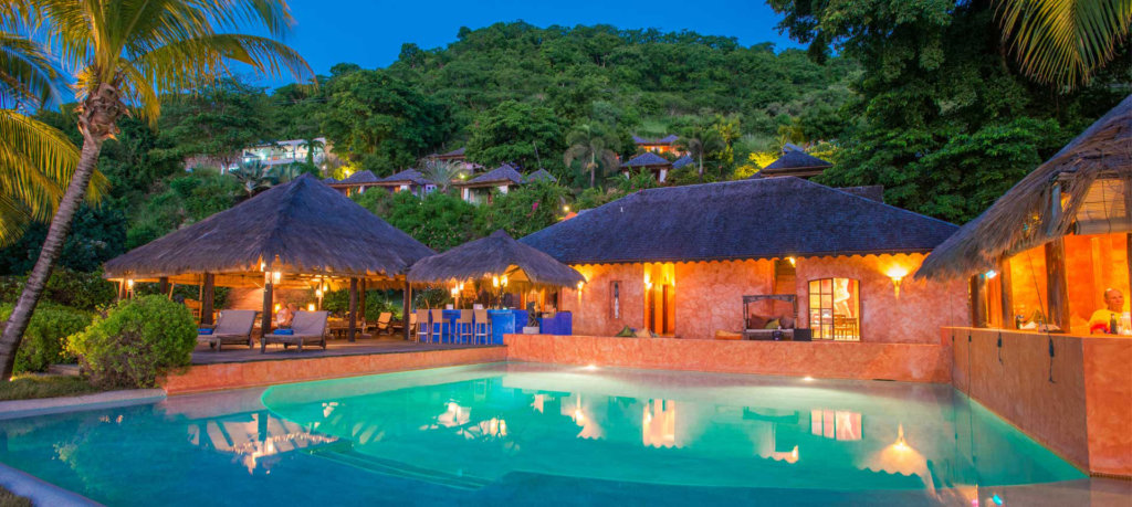 small luxury resort Caribbean pool reflection