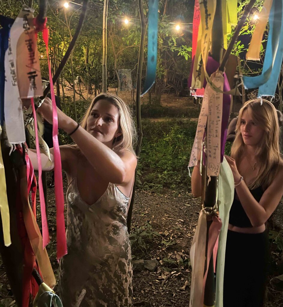 laluna guests tying their new years wishes on the wishing tree